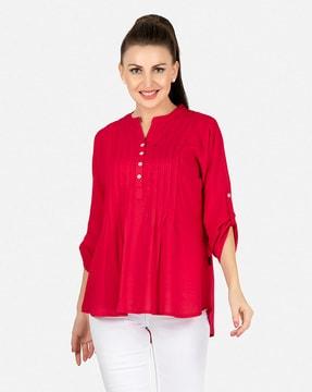 pleated tunic with curved hem