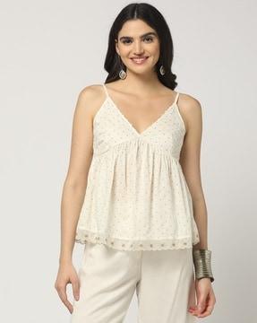 polka-dot print peplum top with embroidered lace