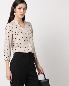 polka-dot print top with patch pockets