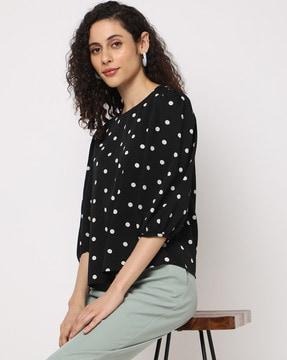 polka-dot print top with puff sleeves
