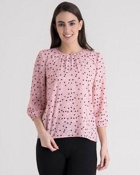 polka-dotted round-neck top