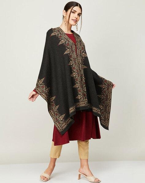 poncho with woven motifs