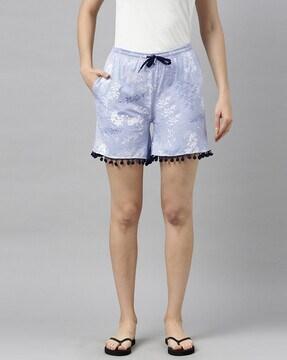 printed shorts with pom-poms