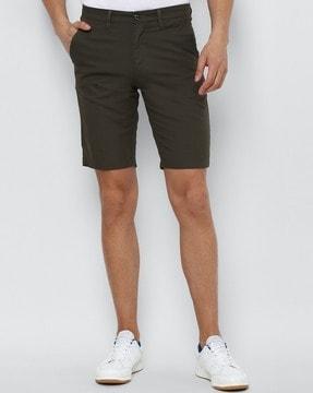 printed slim fit flat-front shorts