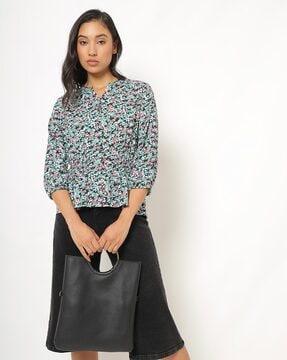 printed top with cuffed sleeves