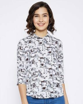 printed top with curved hemline