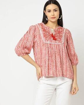 printed top with embroidered yoke