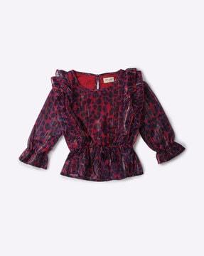 printed top with ruffled overlay