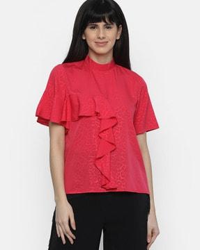 printed top with ruffled panel