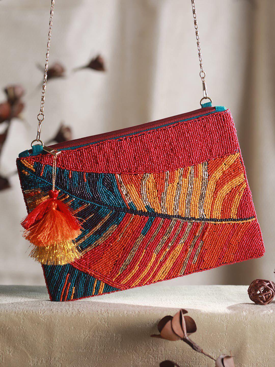 priyaasi orange embellished sling bag with tasselled