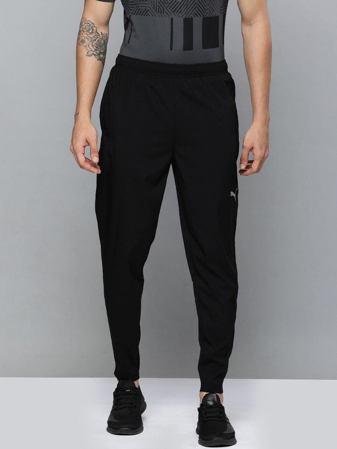 puma men black brand logo printed tapered fit drycell track pants