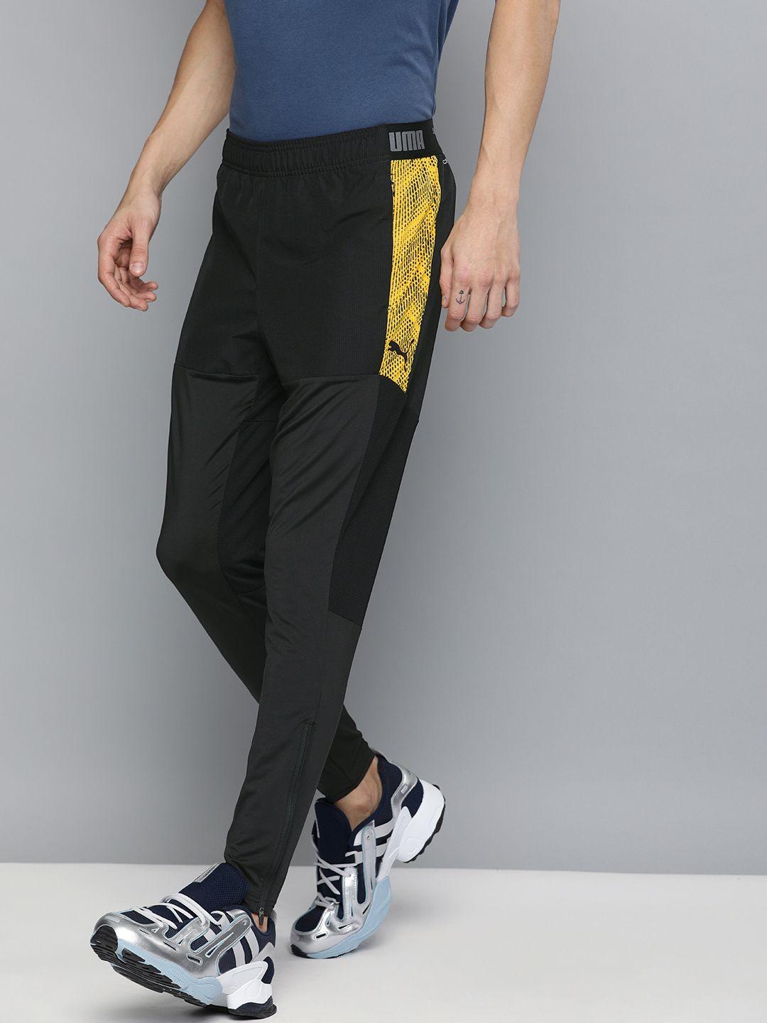 puma men black straight fit lnxt pro solid drycell track pants with printed detailing