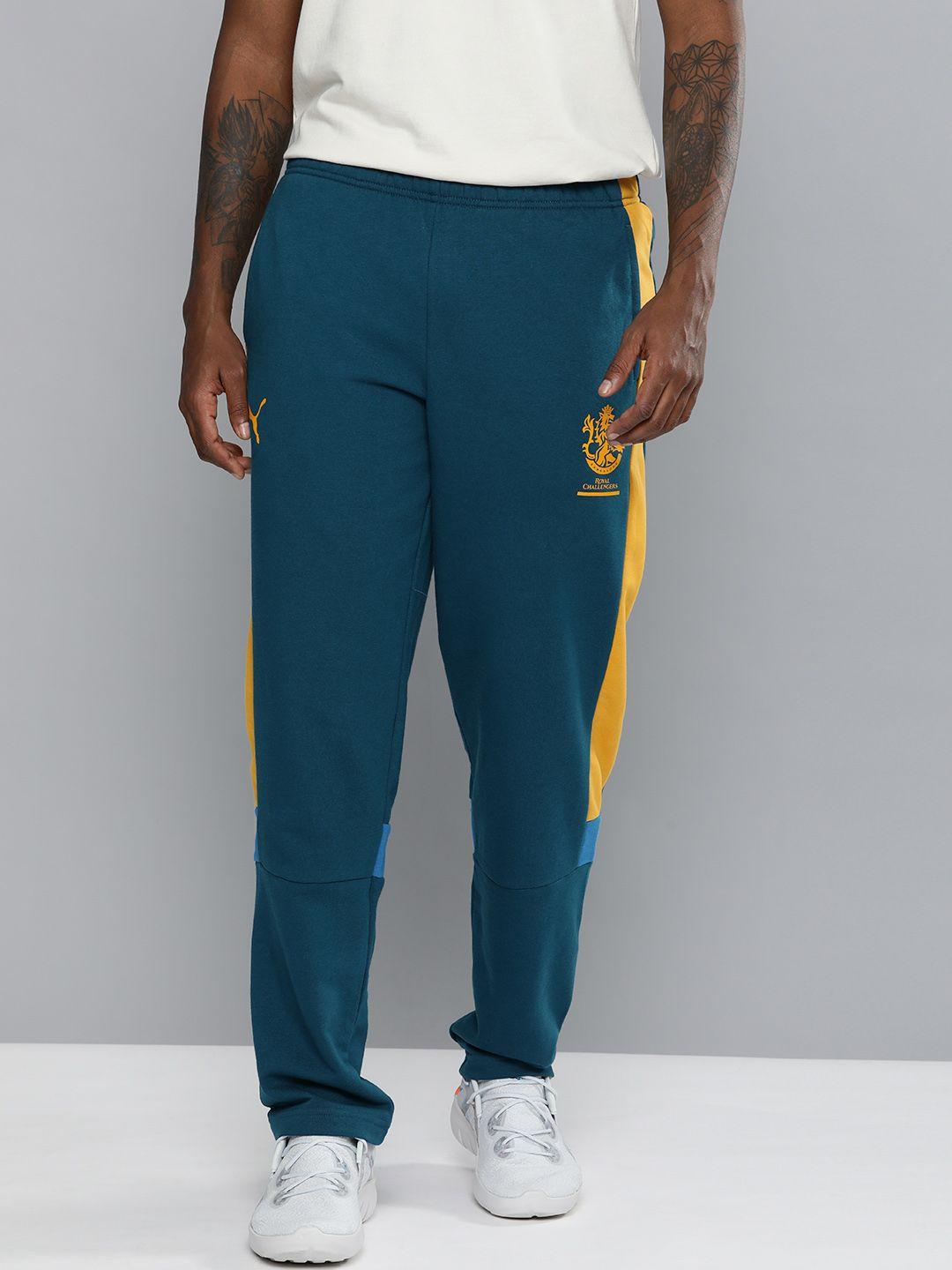 puma men blue & yellow printed rcb knitted track pants