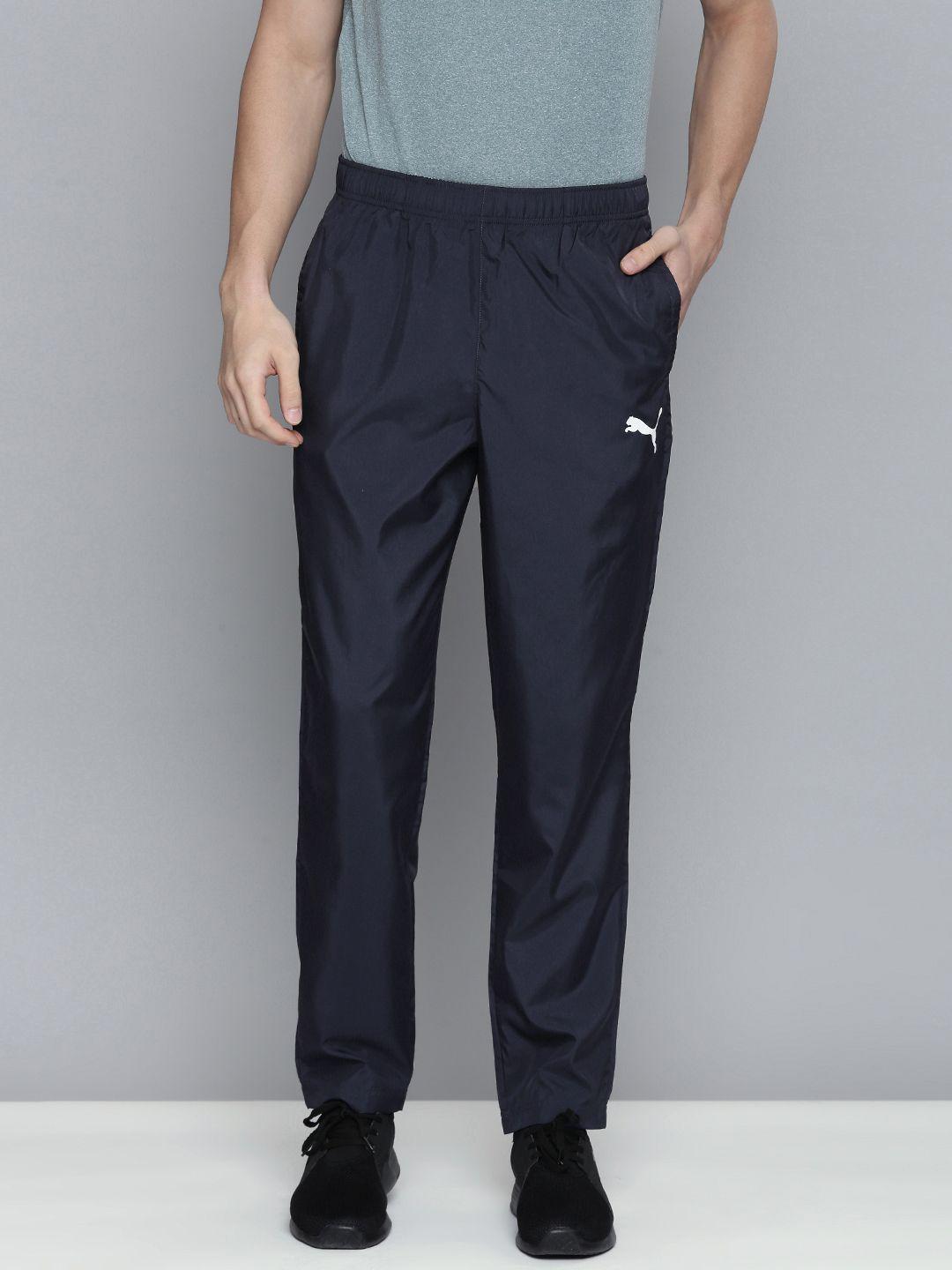 puma men navy blue solid slim fit track pants