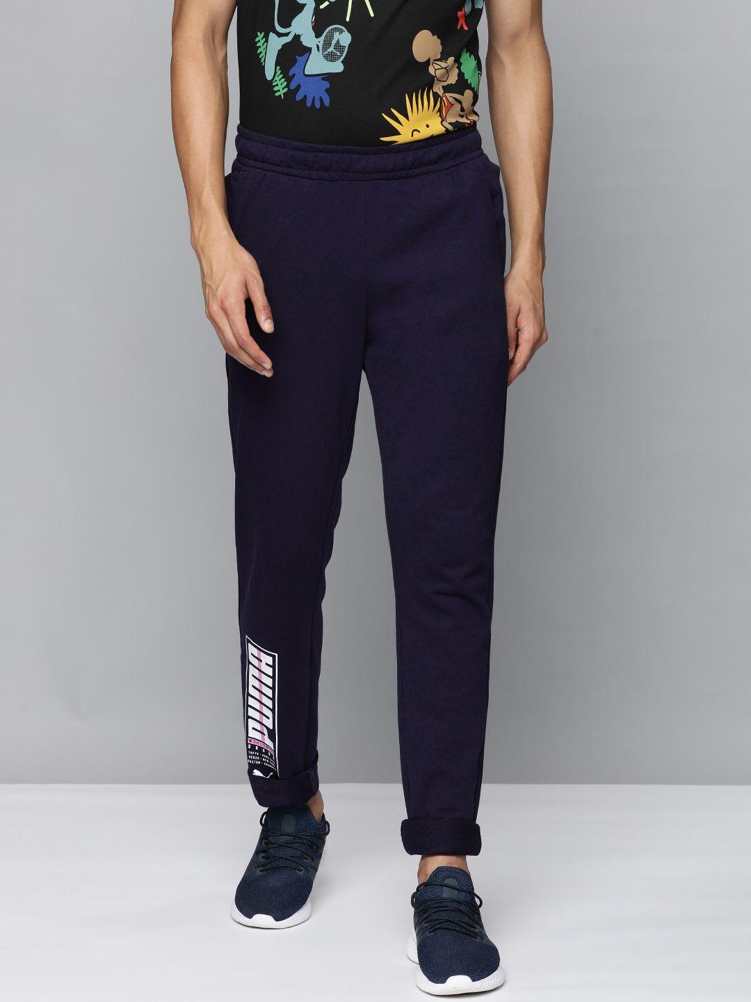 puma men navy blue typography printed slim fit regular track pants