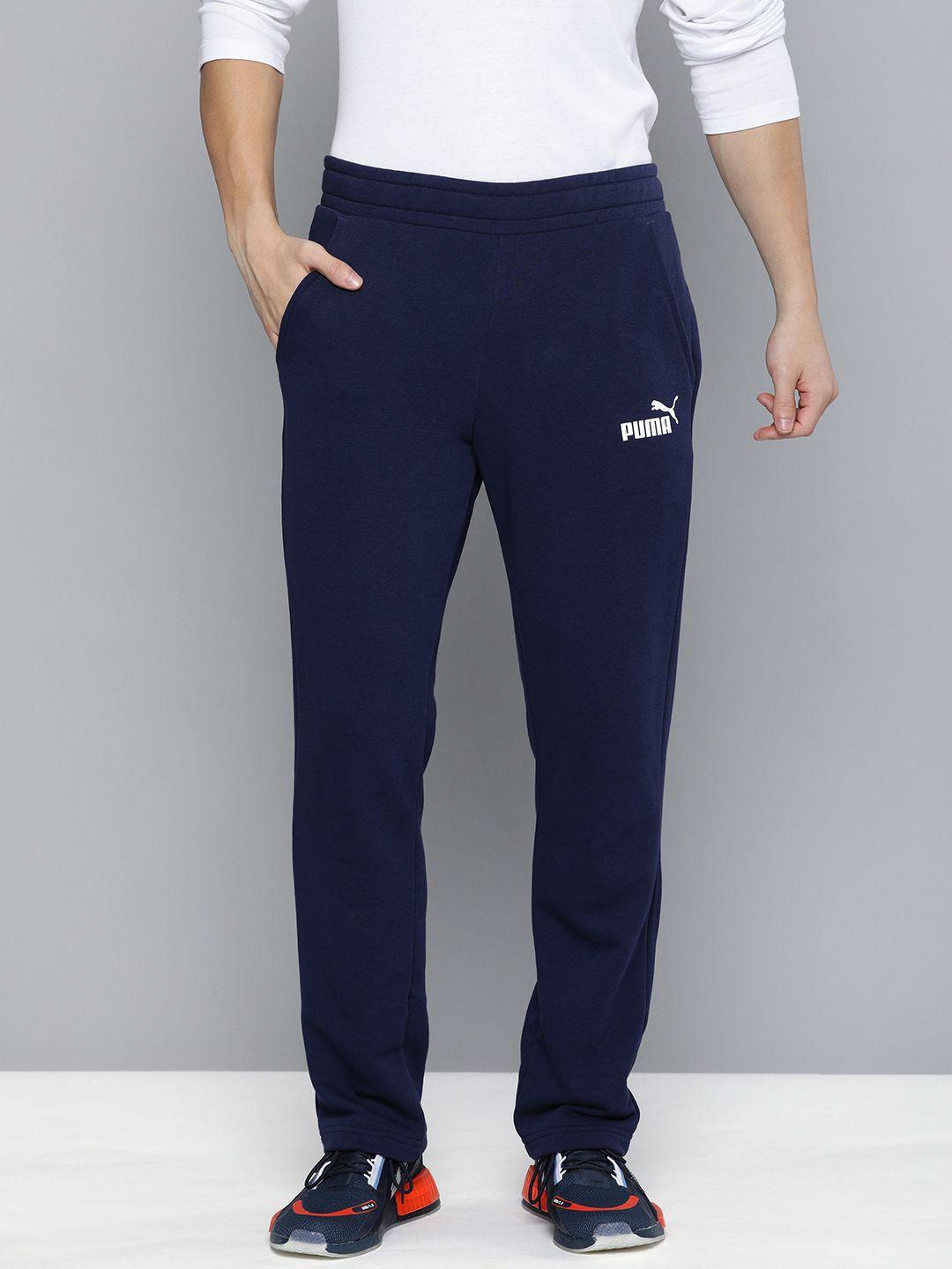 puma men peacoat solid ess logo tr op sustainable sustainable track pants