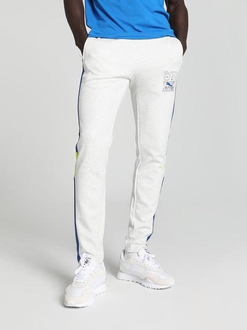 puma white & blue cotton slim fit puma x one8 printed trackpants