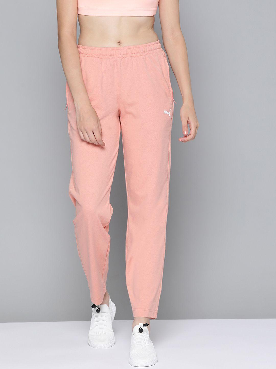 puma women peach-coloured regular fit zippered jersey solid sweatpants
