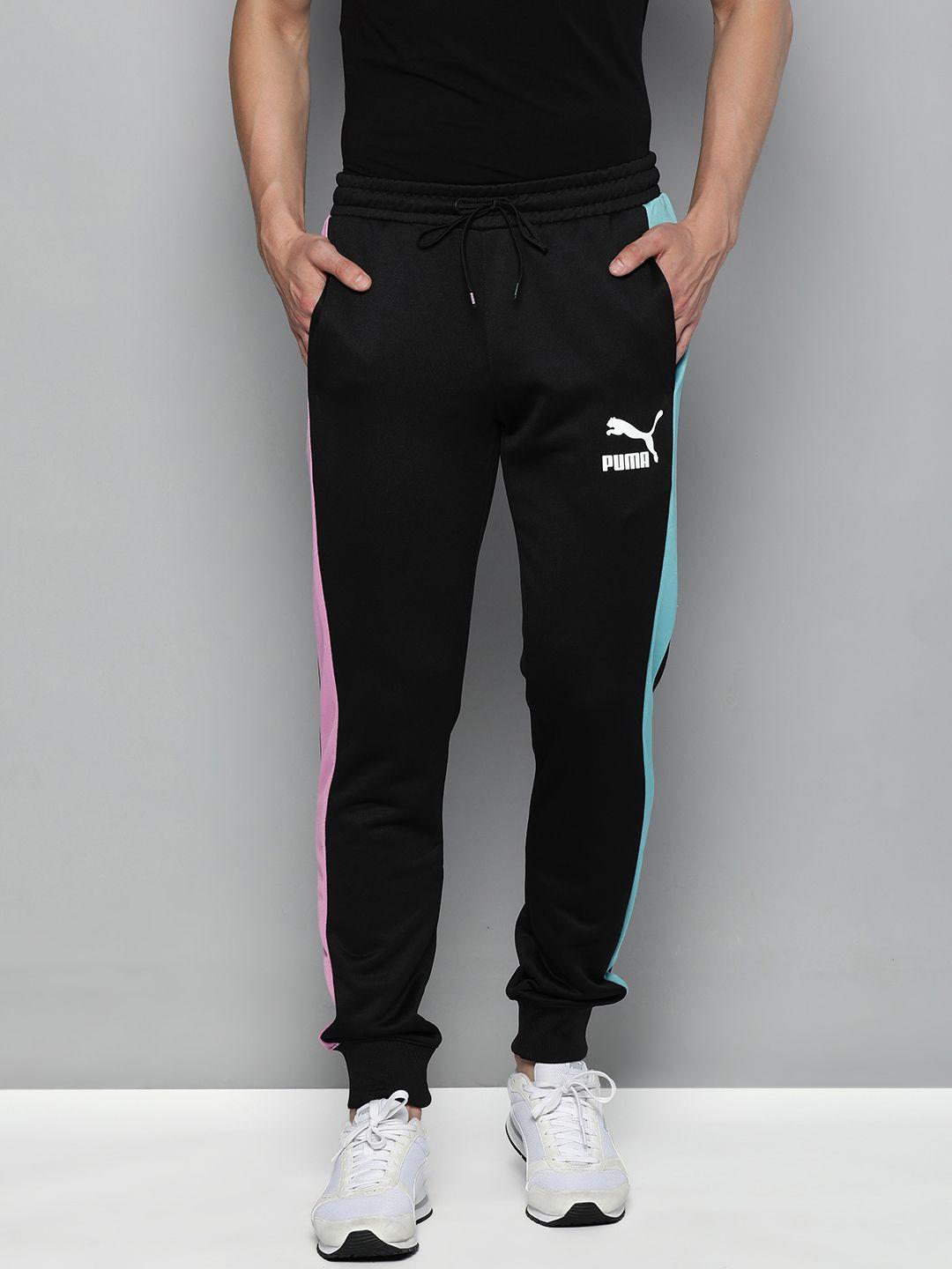 pume men black brand logo printed regular fit mid rise sustainable joggers with constrast side stripes