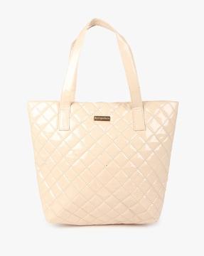 quilted patent tote bag with metal logo accent