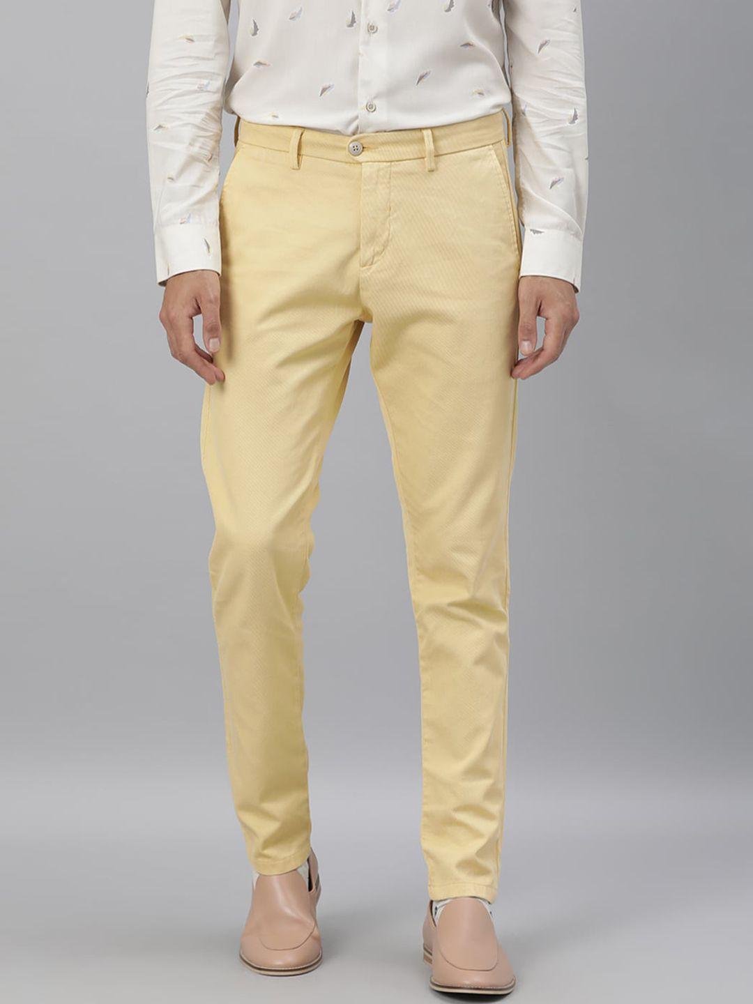 rare rabbit men yellow solid slim fit regular trousers