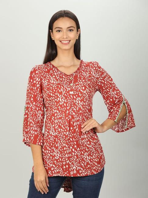 red abstract print v neck top