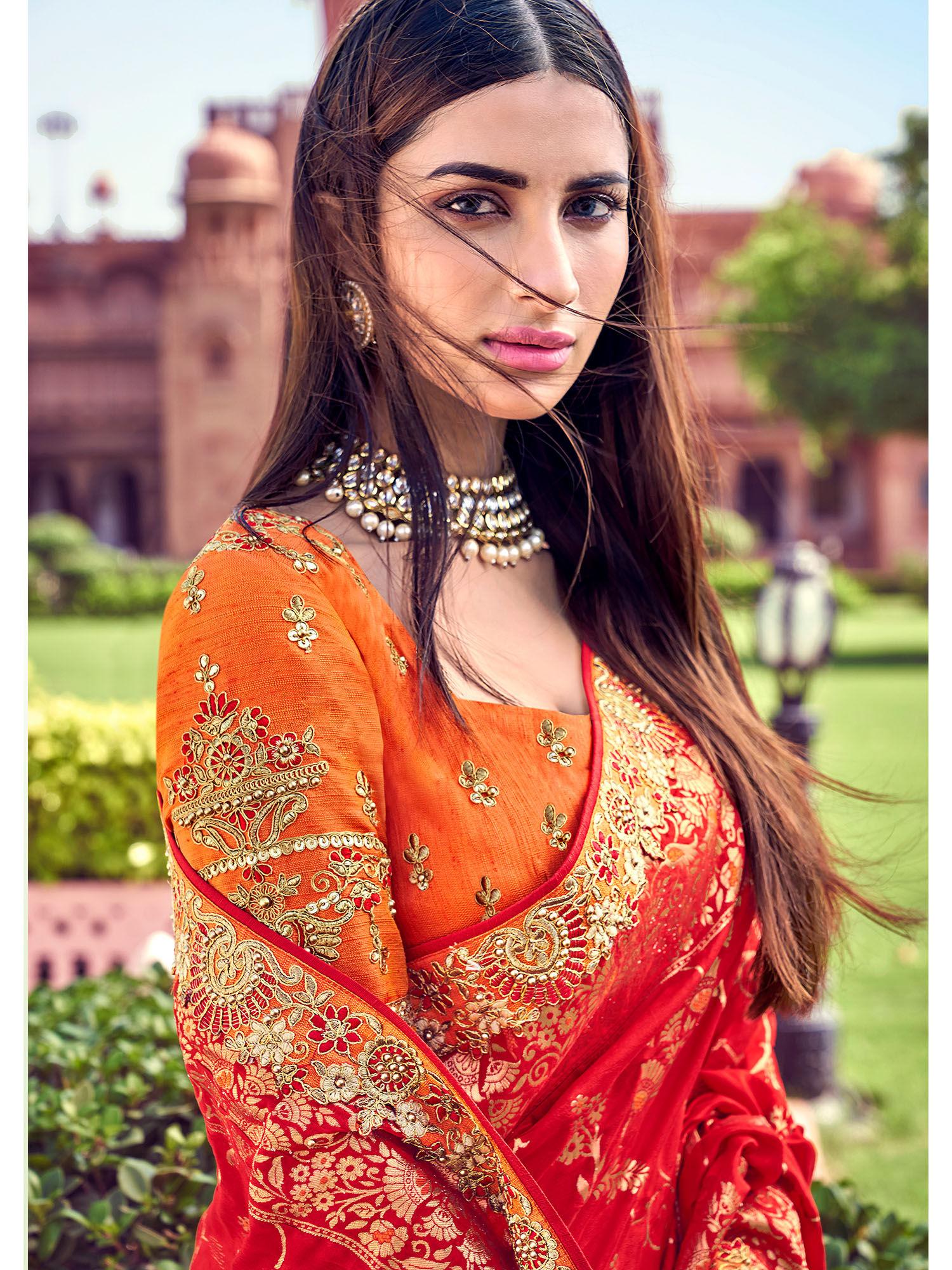 red and orange color silk embroidered saree with un-stitched blouse