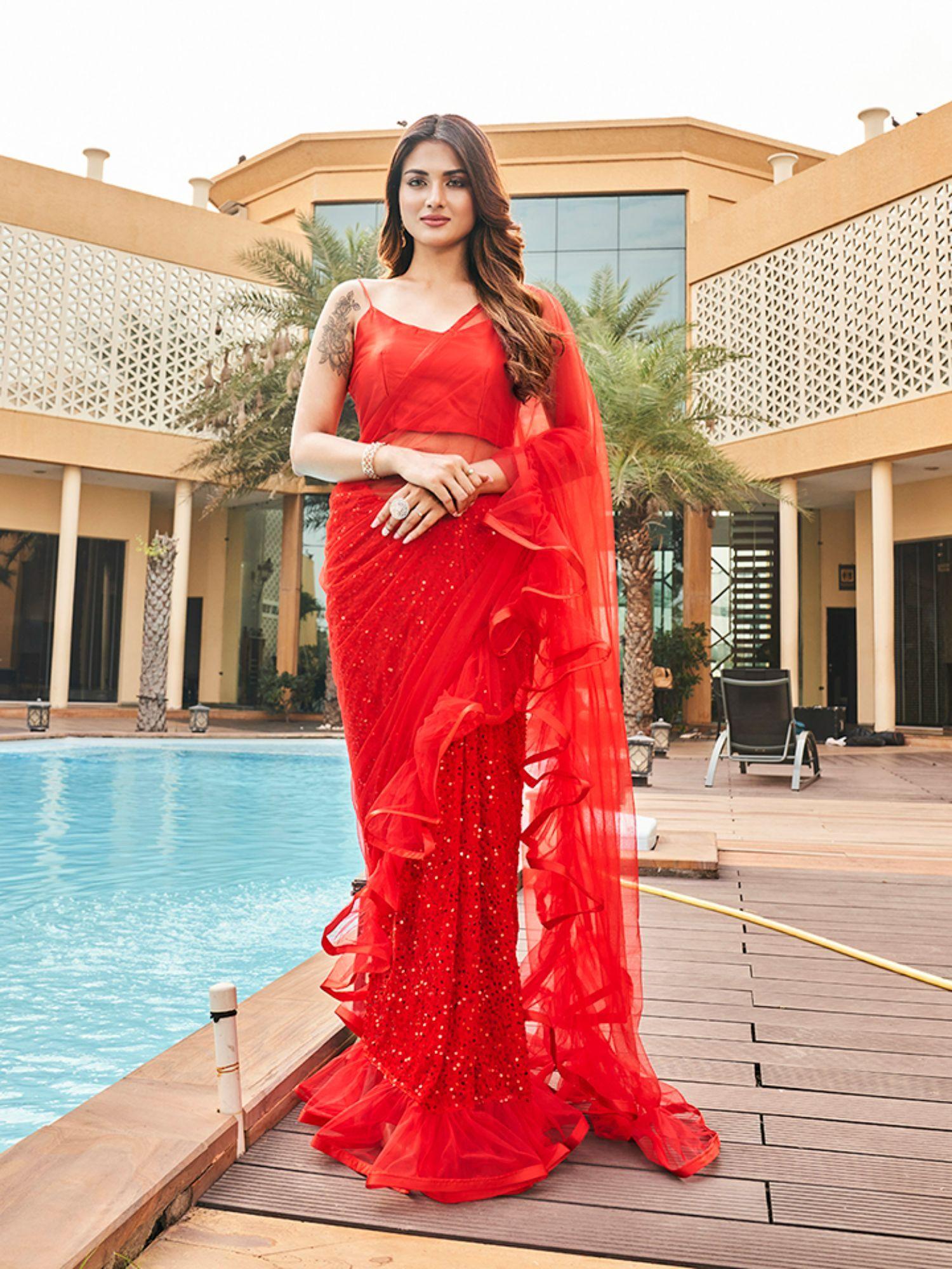 red colored polyester net and velvet half and half sequinned saree with unstitched blouse