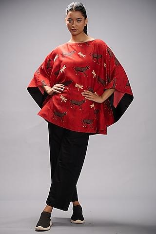 red embroidered poncho