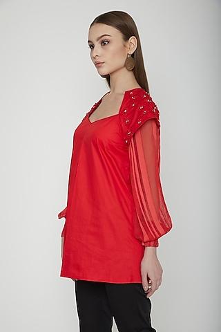 red embroidered power shoulder top