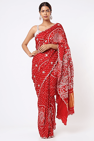 red embroidered saree with blouse piece
