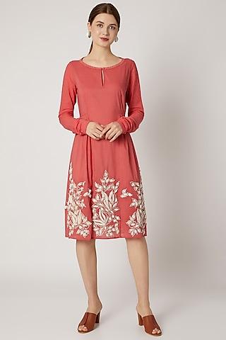 red embroidered tunic with textured sleeves