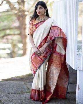 red floral kanjeevaram art silk saree with geomatrical border and heavy zari pallu traditional saree
