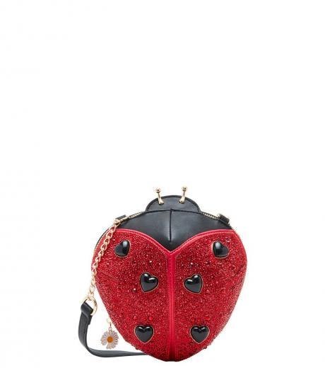 red lady in red small crossbody bag