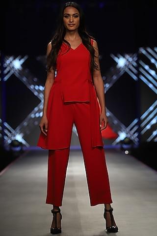 red side draped top with pants