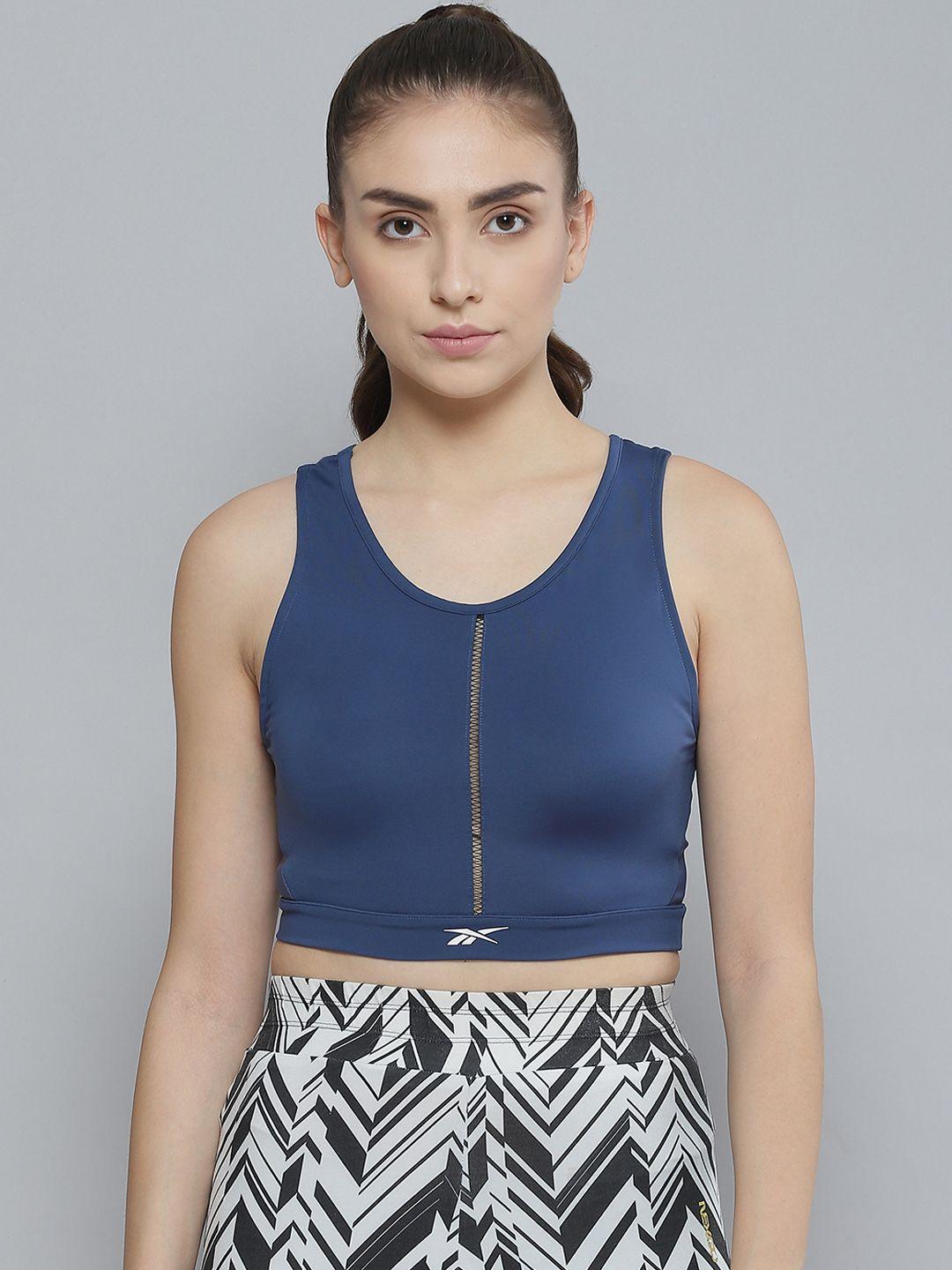 reebok women blue solid lux perform crop top with styled back