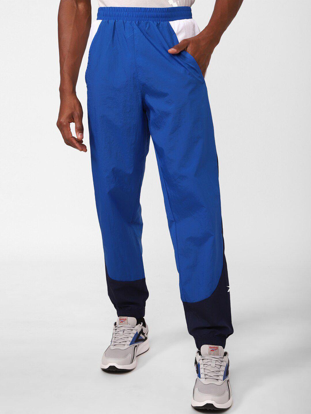 reebok men train woven colourblocked joggers