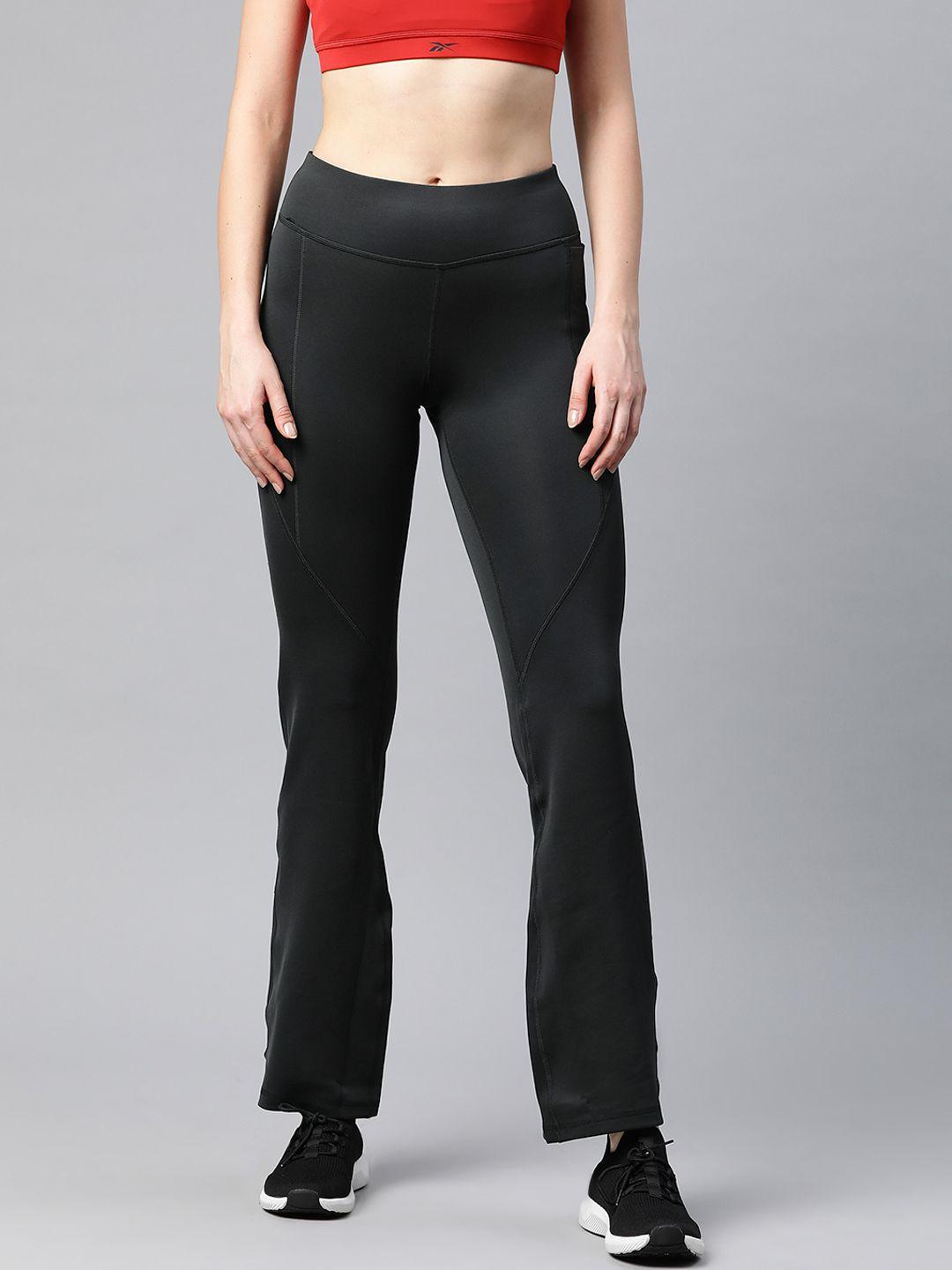 reebok women black solid workout ready bootcut training track pants