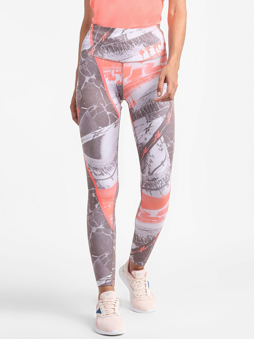 reebok women peach-coloured & mauve all over print sustainable workout tights