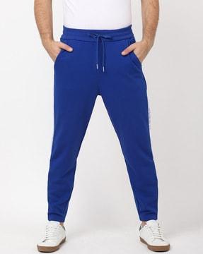 regular fit track pants with typographic taping