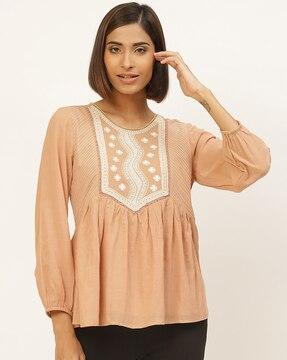 relaxed fit a-line tunic with embroidered yoke