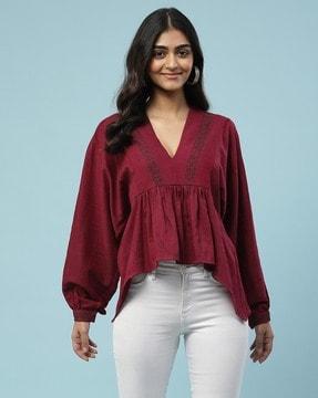 relaxed fit embroidered peplum top