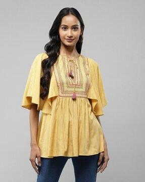 relaxed fit embroidered top with drawstring tie-up neck