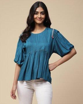 relaxed fit peplum top with cuffed sleeves