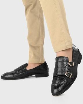 reptilian pattern slip-on shoes