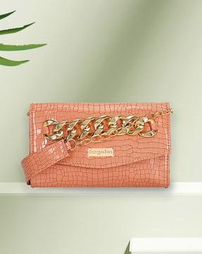 reptilian pattern envelope clutch with chain strap