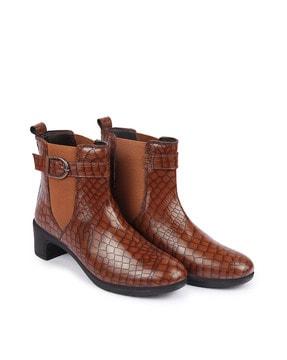 reptilian pattern slip-on boots
