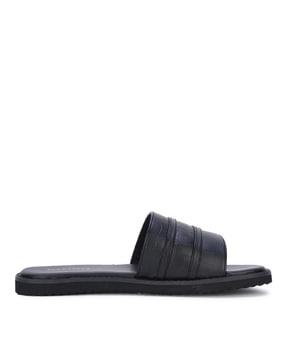 reptilian sliders with leather upper