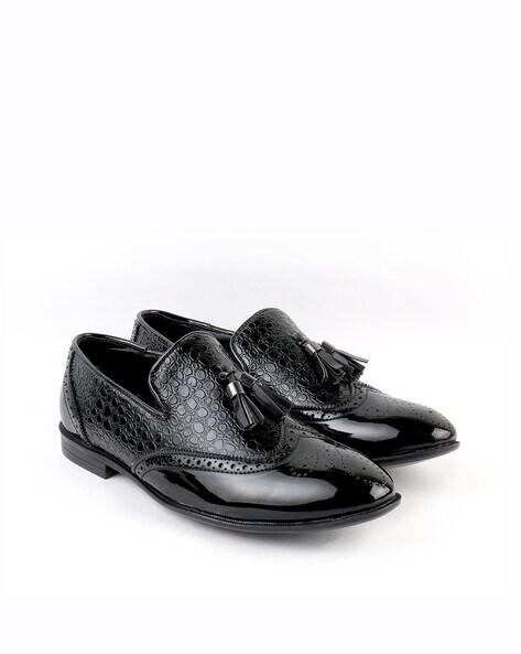 reptilian slip-on shoes with broguing