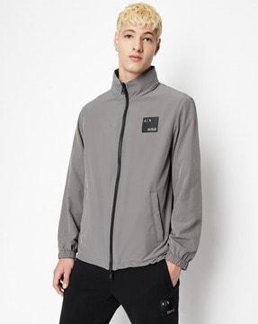 reversible jacket with jacquard logo patch
